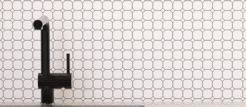 Modern and minimal built-in blue kitchen counter with beige marble top, sink, black faucet and white mosaic tile wall for product displa